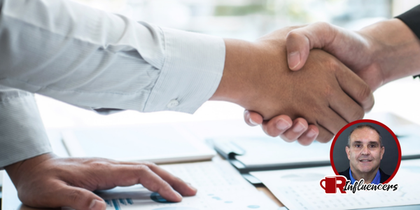 close up shot on the hands of two business people shaking, John Kenney’s headshot in the bottom right